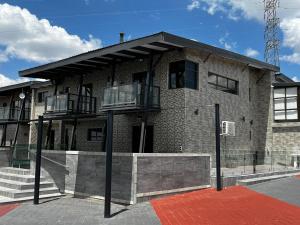 a building with two balconies on the side of it at Dips And T Hotel & Spa in Bloemfontein