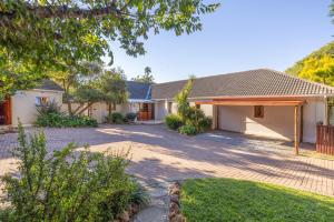 a house with a driveway in front of it at 1 on Ross in Grahamstown