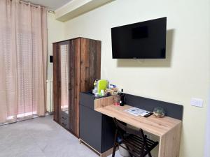 TV a/nebo společenská místnost v ubytování Urban Suite Milano
