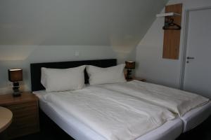 Postel nebo postele na pokoji v ubytování Hotel Haus Wittwer