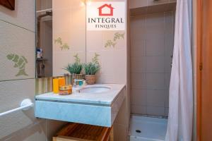 a bathroom with a sink and a mirror at Sal de Mar - Casa La Fosca in Palamós +30 photos