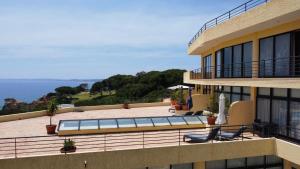 a view from the balcony of a building with a swimming pool at Foz Club - Algarve in Alvor