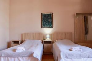Voodi või voodid majutusasutuse Guesthouse Edena toas