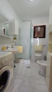 a bathroom with a shower and a toilet and a sink at Apartment Miro- 5 km from Opatija in Matulji +26 photos