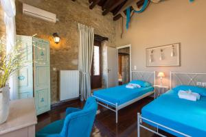 A bed or beds in a room at Dotira