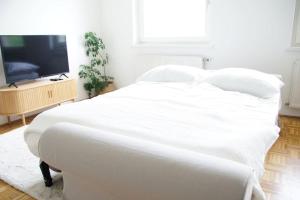 Postel nebo postele na pokoji v ubytování Quartier 27 - Apartment 60m2