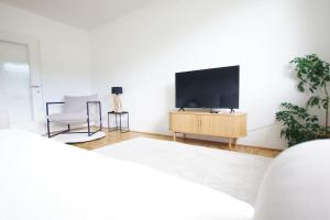 TV a/nebo společenská místnost v ubytování Quartier 27 - Apartment 60m2
