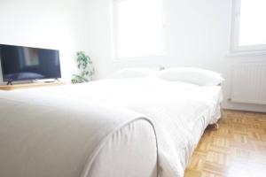 Postel nebo postele na pokoji v ubytování Quartier 27 - Apartment 60m2