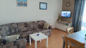 a living room with a couch and a table at Apartment Miro- 5 km from Opatija in Matulji