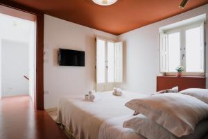 Postel nebo postele na pokoji v ubytování Palazzo D'Azeglio