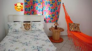 a bedroom with a bed with a canopy at hostel pantaneiro in Aquidauana