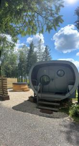 a statue of a machine in a park at Celtic Minor Pods in Ystalyfera