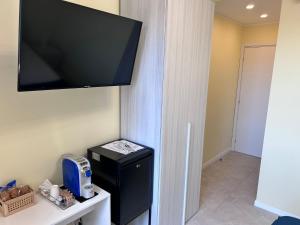 TV a/nebo společenská místnost v ubytování Urban Suite Milano