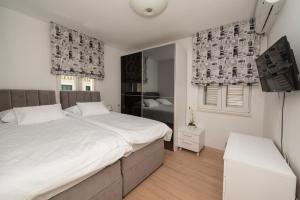 Lova arba lovos apgyvendinimo įstaigoje Lavanda Residence with Heated Pool Trogir Split dar 61 nuotrauka