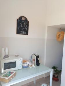 Kuchyň nebo kuchyňský kout v ubytování Le Tre Rose di Roberta