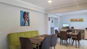 a dining room with a table and chairs at Shara Hotel in Mestia