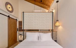 a bedroom with a large bed with white pillows at Villa Vrachos luxury Living in Vrachos +110 photos
