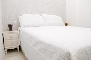 A bed or beds in a room at Macarena Home