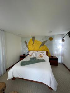 Łóżko lub łóżka w pokoju w obiekcie Casa del Oro