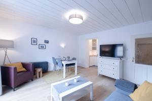 Televízia a/alebo spoločenská miestnosť v ubytovaní Gregor's Sonnenapartment