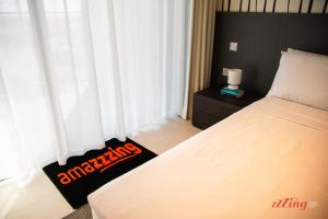 a bedroom with a bed with white curtains at Exclusive Luxury at Mercury Towers in St Julian's