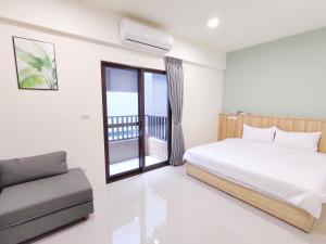 Postel nebo postele na pokoji v ubytování Wish Homestay