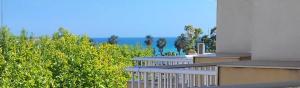 a balcony of a building with a view of the ocean at BLUE PLATAN Apartment in Salou