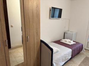 Postel nebo postele na pokoji v ubytování Andolly Apartments