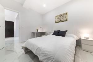 Posteľ alebo postele v izbe v ubytovaní Apartamento San Félix, Playa La Caleta