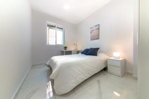 Posteľ alebo postele v izbe v ubytovaní Apartamento San Félix, Playa La Caleta