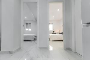 Posteľ alebo postele v izbe v ubytovaní Apartamento San Félix, Playa La Caleta