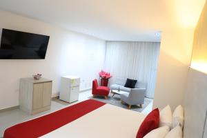 TV a/nebo společenská místnost v ubytování Hotel Súper Estrellas