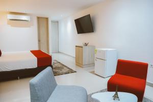 TV a/nebo společenská místnost v ubytování Hotel Súper Estrellas