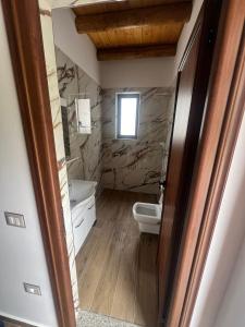 Koupelna v ubytování Guest House Bracaj