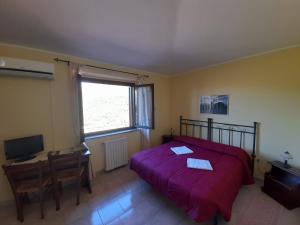 Ένα ή περισσότερα κρεβάτια σε δωμάτιο στο Hotel Sant'elene