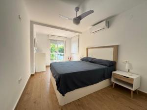 a bedroom with a large bed and a window at La Casita Beach Garden By Sunset in Alicante +43 photos