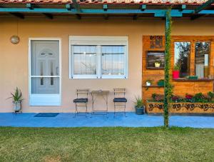 a table and chairs outside of a house at Luxury Cityview Apartment with Garden in Serres