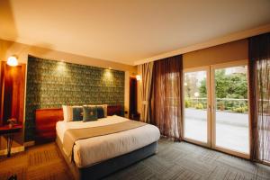 Cama ou camas em um quarto em Double Bond Hotel Spa