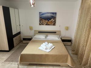 Postel nebo postele na pokoji v ubytování Andolly Apartments