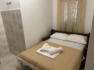 Postel nebo postele na pokoji v ubytování Andolly Apartments