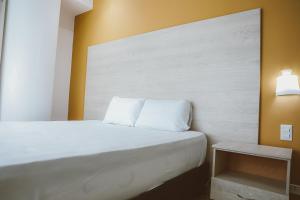 Postel nebo postele na pokoji v ubytování Hotel Súper Estrellas