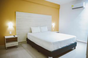 Postel nebo postele na pokoji v ubytování Hotel Súper Estrellas