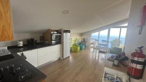 a kitchen with a view of the ocean from at Casa Malee in Calheta