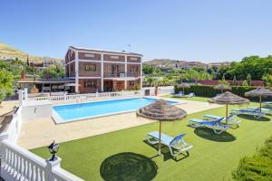 an image of a villa with a swimming pool at La Casita de Rufo in Granada