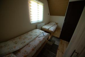 Postel nebo postele na pokoji v ubytování Planinska kuca Pantelic