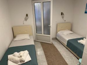 Postel nebo postele na pokoji v ubytování Andolly Apartments