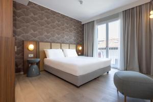 Postel nebo postele na pokoji v ubytování Hotel Diana