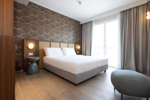 Postel nebo postele na pokoji v ubytování Hotel Diana