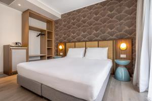 Postel nebo postele na pokoji v ubytování Hotel Diana