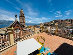 a view from the balcony of a building with a clock tower at La Gaetana in Gaeta